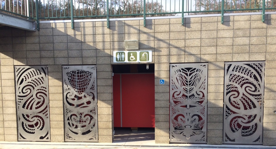 Toilets at Waipa with carved patterns